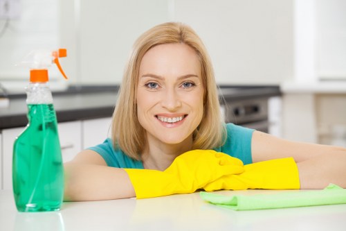A local oven cleaner working in a Belsizepark flat with limited kitchen space