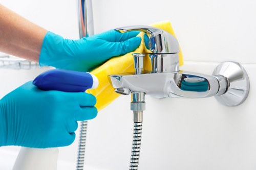 Professional cleaner preparing a Belsizepark property for a detailed one-time clean