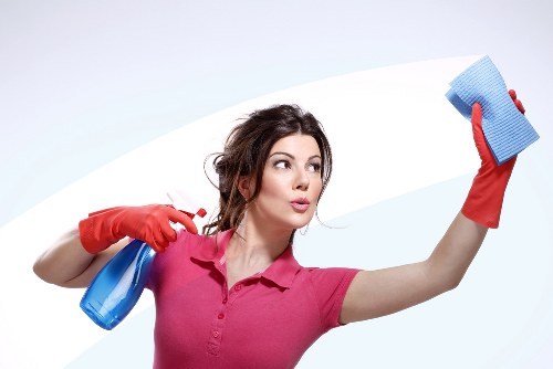 Cleaner treating a carpet stain in a Belsizepark home